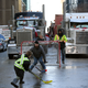Protesters and supporters play street hockey as demonstrators continue to protest the vaccine mandates implemented by Prime Minister Justin Trudeau on February 7, 2022 in Ottawa, Canada. - Canadian authorities struggled Monday to tackle a truckers’ protest against Covid restrictions which has paralyzed the national capital for days and threatens to snowball into a full-blown political crisis for Prime Minister Justin Trudeau.